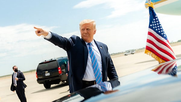 President Donald J. Trump waves and gestures to the crowd upon his arrival to Midland International Air and Space Port in Midland, Texas, Wednesday, July 29, 2020, where he was greeted by Texas Gov. Greg Abbott, former Secretary of Energy Rick Perry, Texas Lt.Gov. Dan Patrick, Texas Republican Chairman Allen West, U.S. Representative candidates, and members of the community. (Official White House photo by Shealah Craighead)