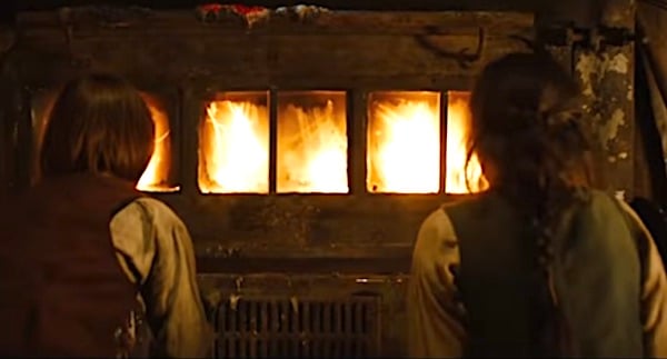 Cedric Eich (Hansel) and Alea Sophia Boudodimos (Gretel) watch the witch burn in an oven in 2013's 'Hansel & Gretel: Witch Hunters' (Paramount Pictures)