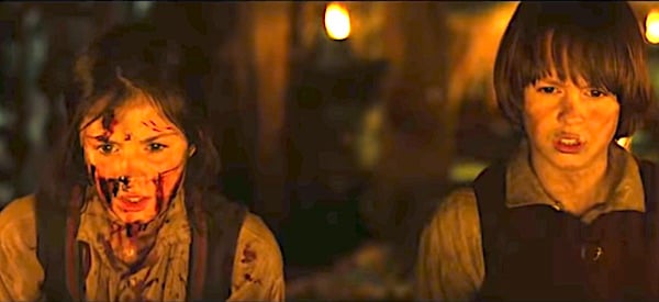 Alea Sophia Boudodimos (Gretel) and Cedric Eich (Hansel) watch the witch burn in an oven in 2013's 'Hansel & Gretel: Witch Hunters' (Paramount Pictures)